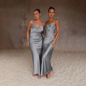 Detail of elegant dark grey satin slip dresses with deep V-neck and draped neckline