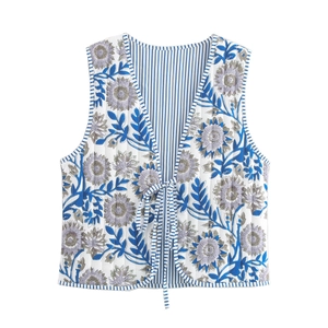 Quilted floral puffer vest with tie-front closure and blue botanical print