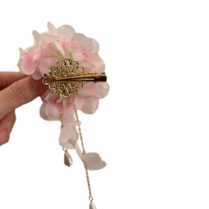 Pink fabric floral hair clip with golden filigree and elegant pearl tassel drop