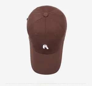 Top view of dark brown cotton baseball cap with white embroidered R letter and soft brim