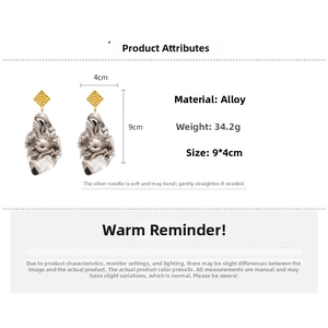 Detailed view of large metallic geometric earrings with dimensions 9x4cm and alloy material