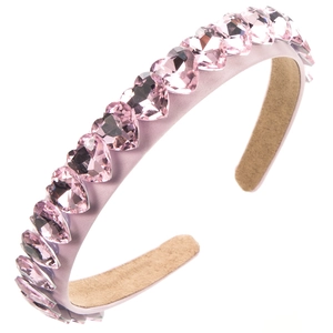 Detail of pink crystal heart headband with luxury satin fabric and non-slip lining