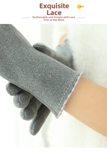 Close-up of winter thermal gloves featuring pink wavy trim and white decorative stitching
