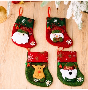 Set of four Christmas mini socks featuring Santa, snowman, reindeer, and polar bear designs
