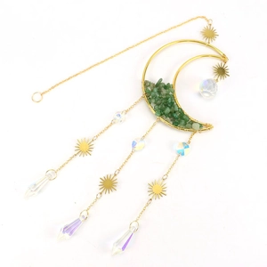 Detail of moon sun catcher with green crystal stones and prism pendant on golden frame