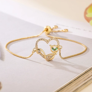 Gold-plated cat heart bracelet with green gemstones and adjustable box chain
