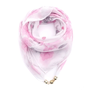 Detailed view of pink floral chiffon scarf featuring a magnetic gold ball pendant clasp