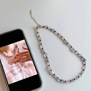 Collana di acquamarina e agata rossa con chiusura a moschettone dorata per donna