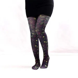 Detail view of sheer tights featuring colorful hollow and solid star pattern motifs