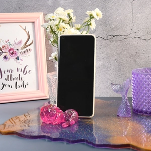 Detail of irregular resin tray mold showing purple gold glitter and star sky effect
