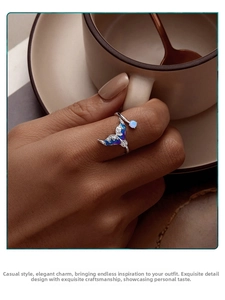 Detailed close-up of a s925 silver fishtail ring with enamel finish and pearl accents