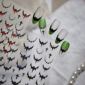 Detail of Gothic bat nail art stickers with 3D effect on professional manicure