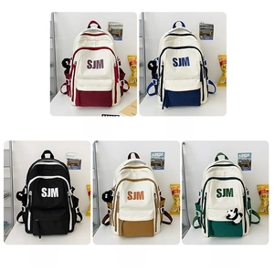 Multiple colors of American vintage canvas backpacks featuring red blue black brown and green