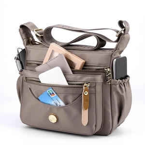 Waterproof nylon multi-pocket crossbody bag in taupe with spacious zipper compartments