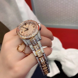 Detailed close-up of luxurious SCOTTIE women's watch featuring a full diamond pavé dial