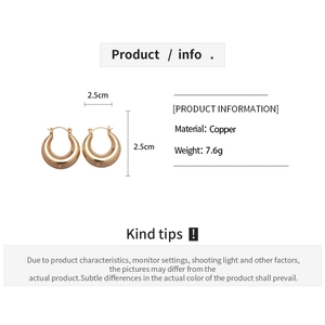 Detail view of 18k gold plated 2.5cm copper hoop earrings with size and weight info