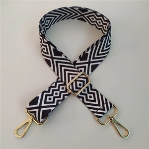 Adjustable black and white geometric bag strap with premium gold metal buckles