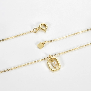 Detailed macro view of S925 hallmark on a gold plated silver letter P necklace chain