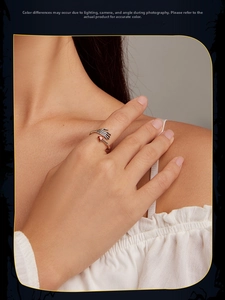 Detailed shot of S925 silver skeleton hand ring holding a red heart-shaped gemstone