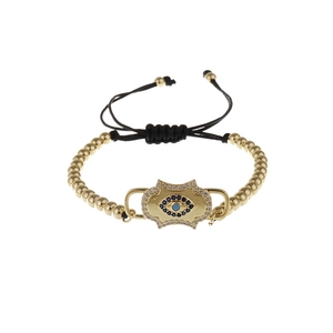 Adjustable black Milan rope bracelet with gold evil eye charm and cubic zirconia