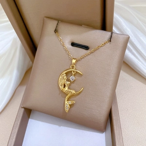 Golden mermaid on crescent moon necklace with zircon stones in a premium jewelry gift box
