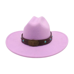 Detail of purple felt cowboy hat featuring bull skull buckle and turquoise leather band