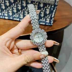 Elegant silver quartz watch for women with sparkling rhinestones and a white mother of pearl dial