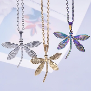 Three dragonfly pendants in silver, gold, and rainbow colors with fine chain necklaces