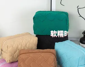 Detailed group view of colorful quilted storage bags showing diverse color options