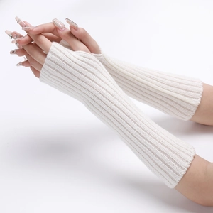 Detail of white ribbed knit arm warmers with fingerless design on model's hand