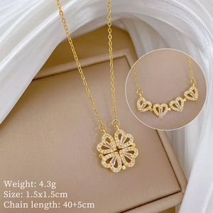 Detail of golden four-leaf clover necklace unfolding into four hearts with dimensions