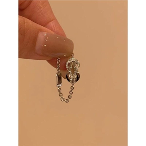 Macro detail of gold plated horseshoe ring featuring micro-pave cubic zirconia crystals