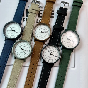 Variety of quartz watches with colorful straps and minimalist dials in a stylish layout