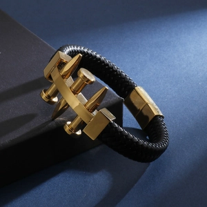 Minimalist black braided leather bracelet with gold nail design and stainless steel clasp