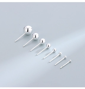 Macro view of S925 sterling silver ball earrings in various sizes with high polish finish