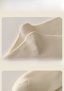 Detail view of cotton crew socks featuring reinforced heel and elastic ribbed cuff texture