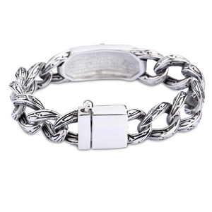 Detailed close-up of retro silver stainless steel bracelet with engraved links and square clasp