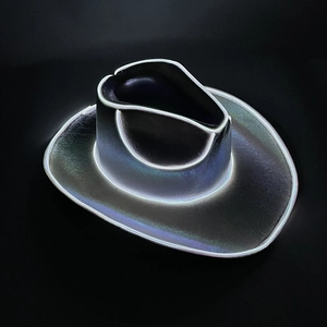 Close-up detail of black woven cowboy hat with LED glowing edge in dark neon light