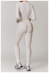 Detail view of high-elastic sports set with scrunch butt leggings and zip jacket