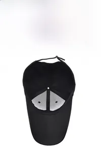 Detail of black baseball cap showing breathable mesh lining and adjustable strap buckle