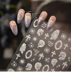 Detail of white laser aurora nail stickers featuring baroque horses and cross patterns