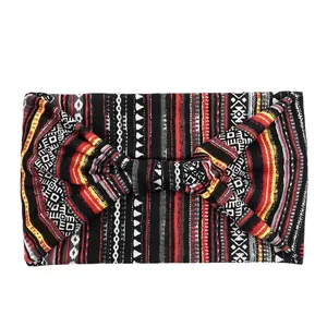 Close-up of ethnic geometric pattern wide headband with bow-knot and elastic fabric