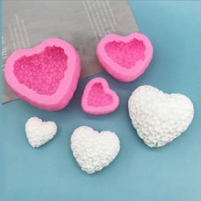 Three sizes of heart-shaped silicone molds with textured floral patterns for DIY crafts