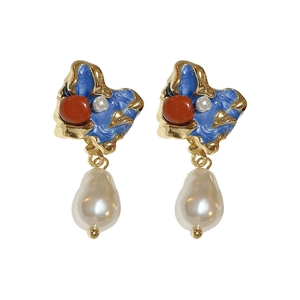 Vintage irregular gold earrings with blue enamel, red accents, and baroque pearls