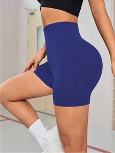 Detail view of seamless high-waist fitness shorts featuring peach butt-lift design