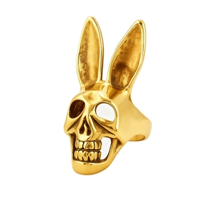 Gothic gold rabbit ear skull ring for women with polished metallic finish on white background