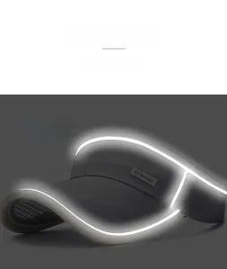 Detail of reflective strips on grey sun visor hat for night safety and visibility