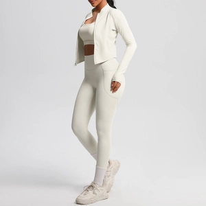 Three-piece yoga set featuring a zip-up jacket, sports bra, and side pocket leggings