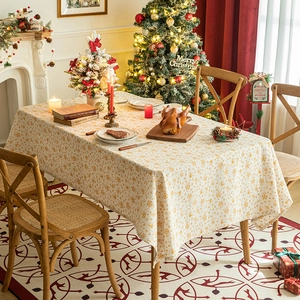 Festive Christmas tablecloth with golden snowflake prints and holiday scene decor