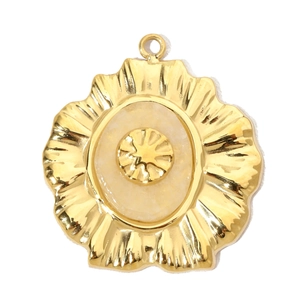 Detailed view of a gold flower-shaped stainless steel pendant with an ivory stone inlay